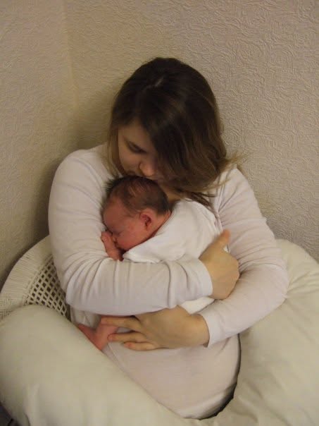 Victoria holding her baby daughter close
